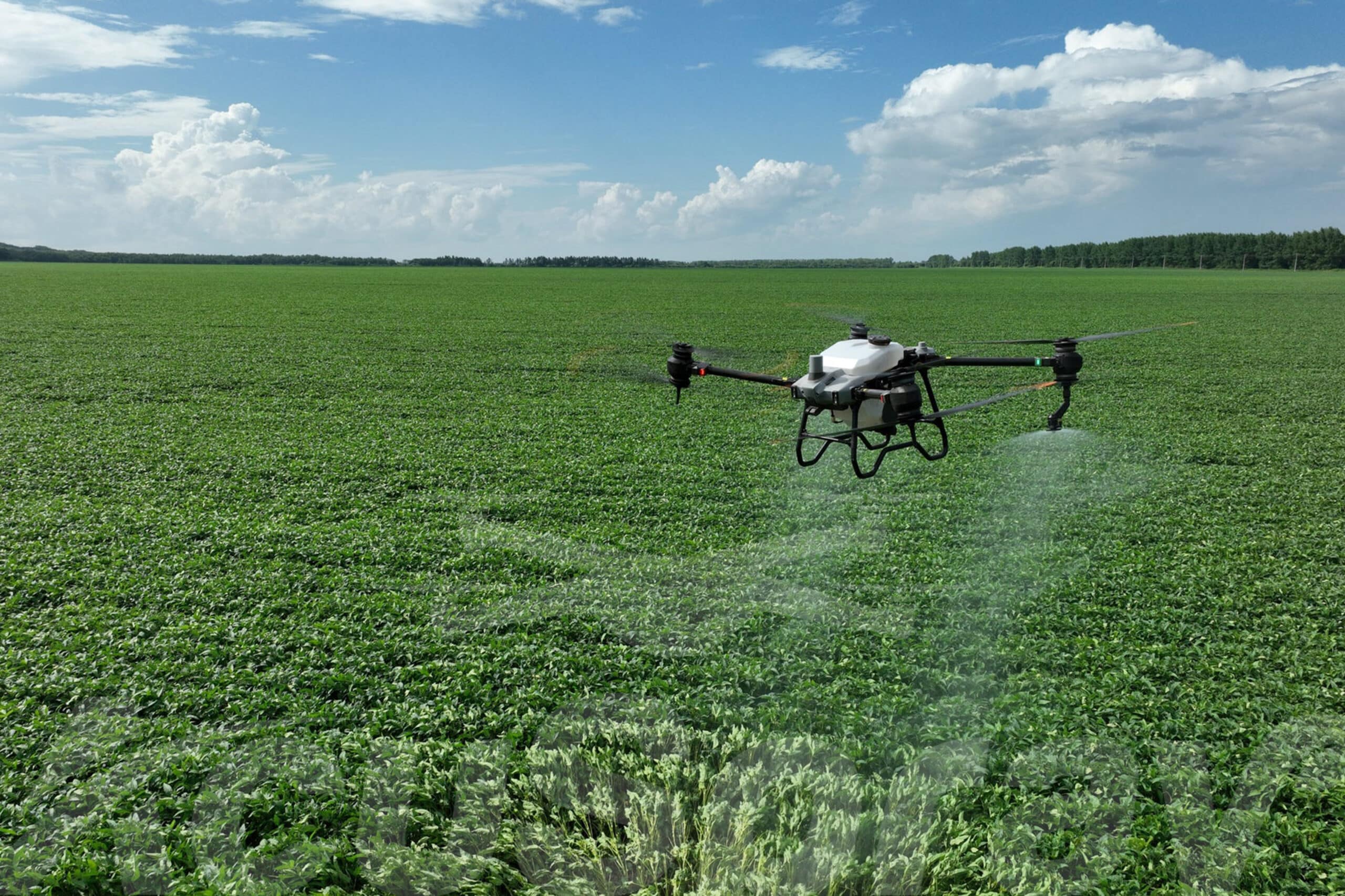 Precision drone technology flying over crops to enhance crop yield.